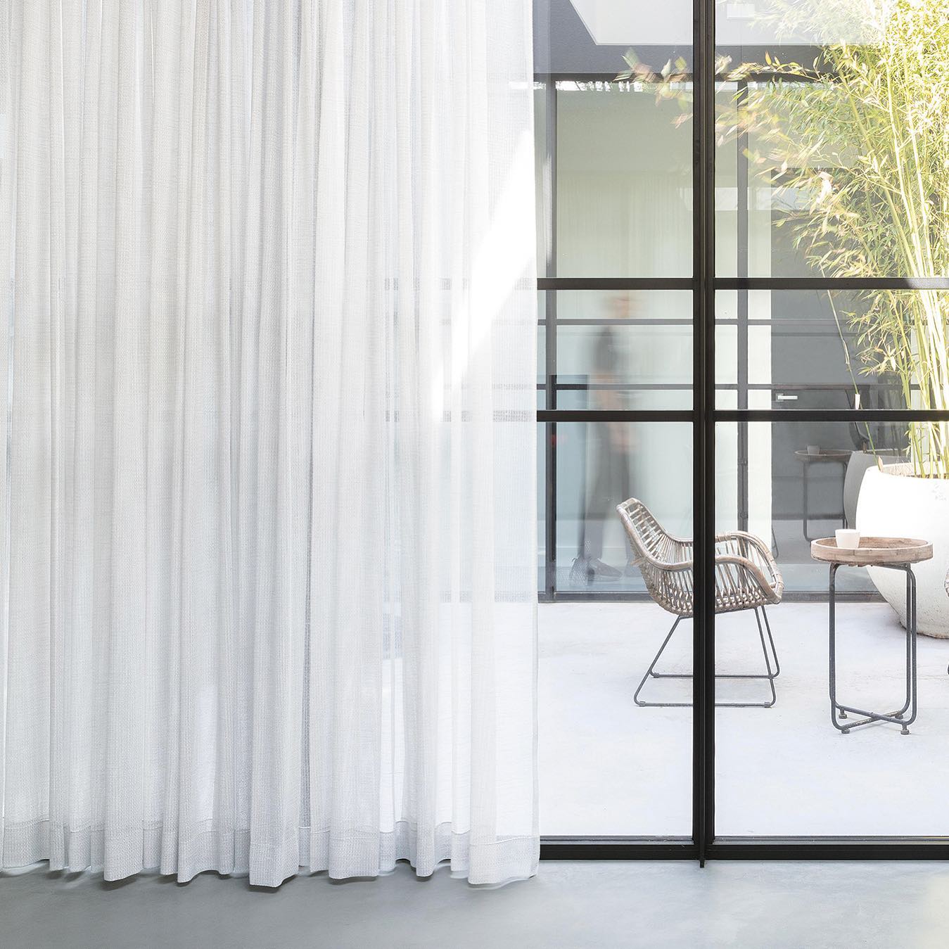 Sheer curtains framing a courtyard, Adelaide home