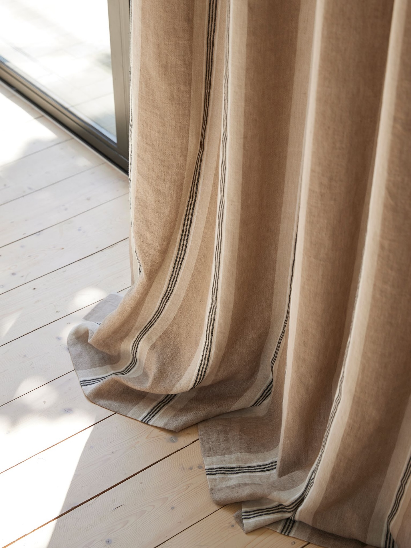 Linen drapery against timber decking